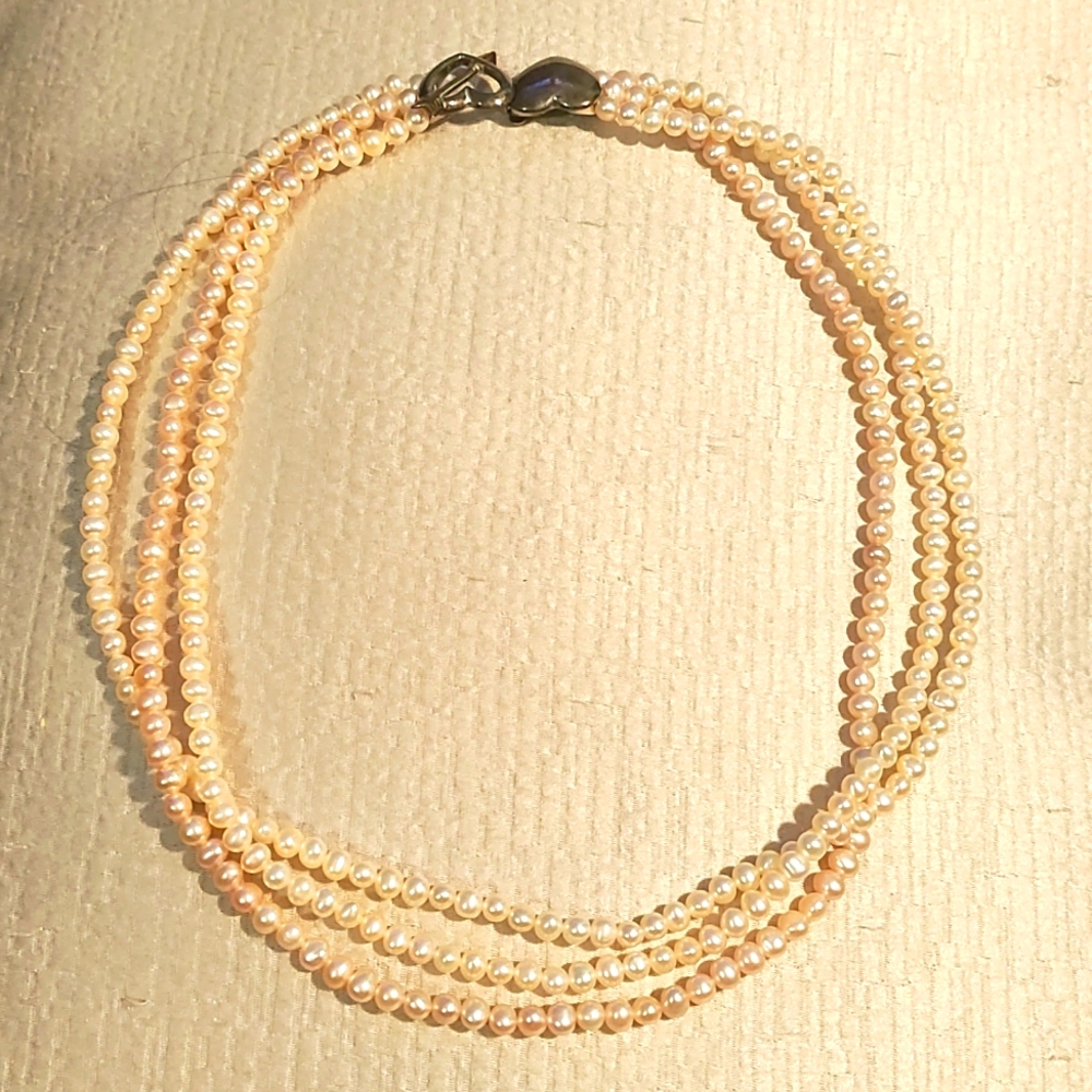 Three string pearl necklace with double heart sterling silver clasp push closure